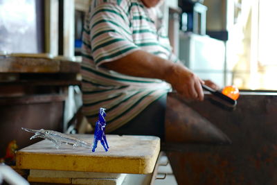 Man working on table at home