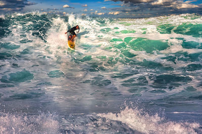 Man surfing in sea