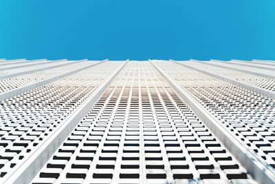 Low angle view of building against clear blue sky