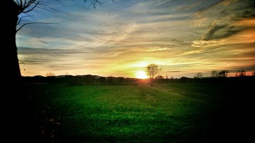 Scenic view of landscape at sunset