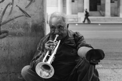 Full length of man playing at music concert