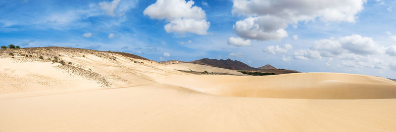 Panoramic view of desert against sky