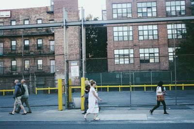 Woman standing in front of building