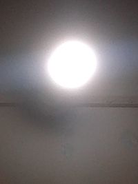 Low angle view of illuminated light against sky