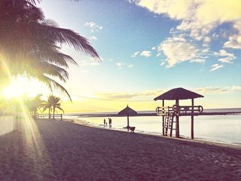 Scenic view of beach against sky during sunset