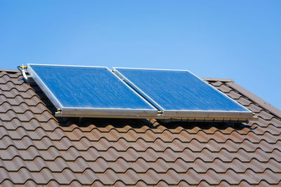 Solar panels on the roof of the house, spring day