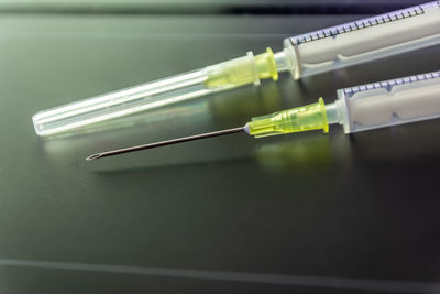 New medical vaccines ready for injection with syringe and vaccine inject the cure for immunization