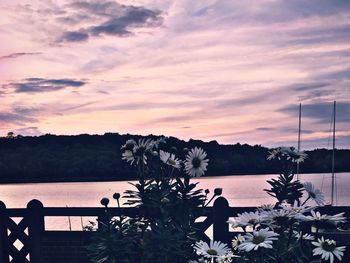 Scenic view of lake against cloudy sky