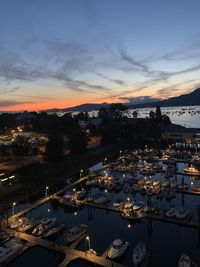 High angle view of illuminated city buildings at sunset