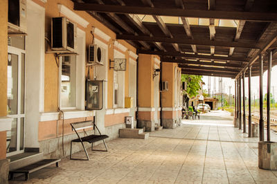 Empty chairs and tables in building