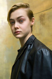 Close-up portrait of young woman standing outdoors