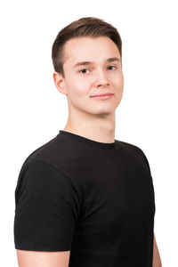 Portrait of man standing against white background