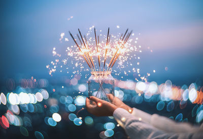 Defocused image of illuminated string lights at night