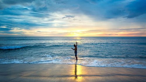 Scenic view of sea at sunset