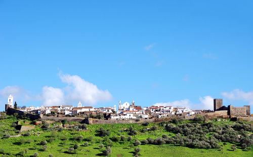 Buildings and field against sky at monsaraz
