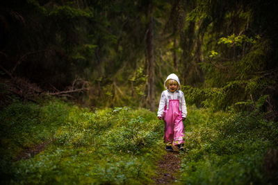 Girl walking in forest