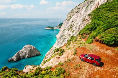 Aerial view of car by cliff in greece