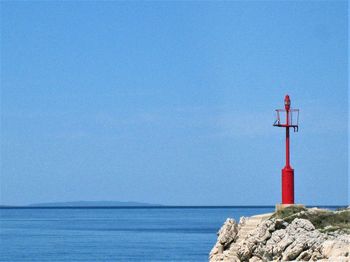 Scenic view of sea against blue sky