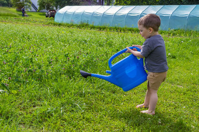 Boy playing with straw