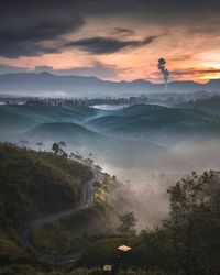 Scenic view of mountains against sky during sunset