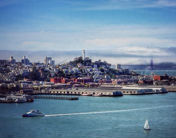 Boats in sea against sky