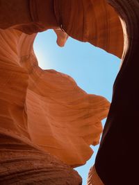 Low angle view of antelope canyon against sky