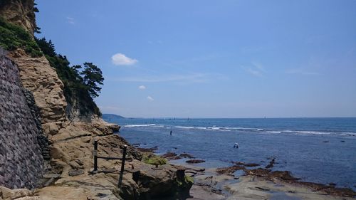 Scenic view of sea against blue sky