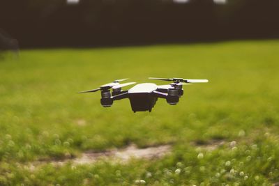 Drone flying over field