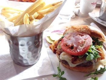 Close-up of burger and french fries on table