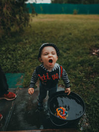 Boy standing on field