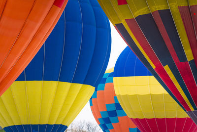 Multi colored hot air balloons flying