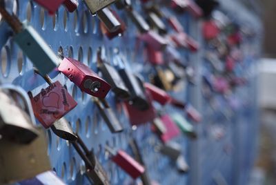 Close-up of padlocks on railing