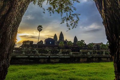 Panoramic view of temple against buildings