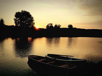 Scenic view of lake at sunset