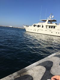 Cropped boat in sea against clear sky