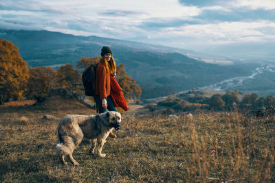 Man with dog on mountain