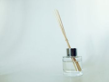 Low angle view of bottle against white background