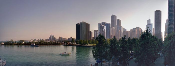 Panoramic view of buildings in city against sky