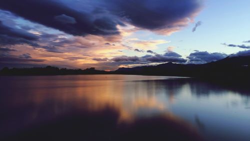 Scenic view of lake against cloudy sky