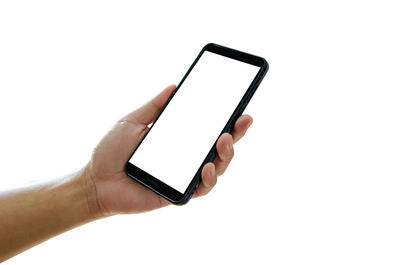 Low angle view of person using mobile phone against white background