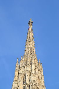 Low angle view of stephansdom, the cathedral of vienna, against blue sky