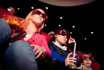 People sitting in movie theater