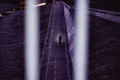 Person walking in tunnel