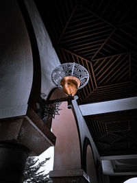 Low angle view of illuminated lights on ceiling in building