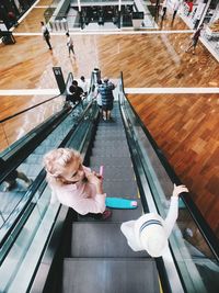 High angle view of woman sitting on table