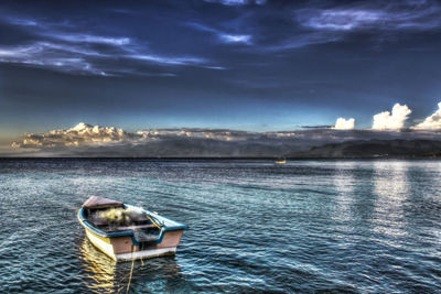 Boat in sea against sky