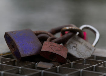 Close-up of love padlocks on railing