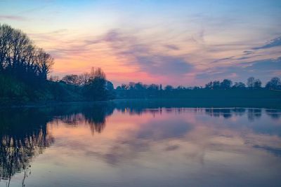 Scenic view of lake against dramatic sky