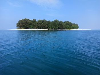 Scenic view of sea against blue sky