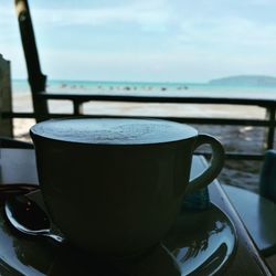 Close-up of coffee cup on table